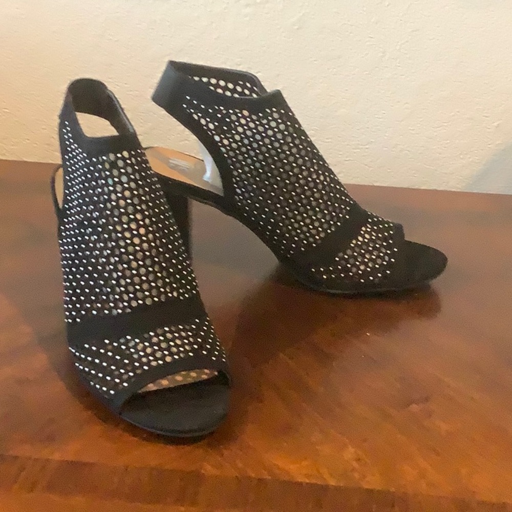 Size 10 with 3 inch block heel. Never worn
